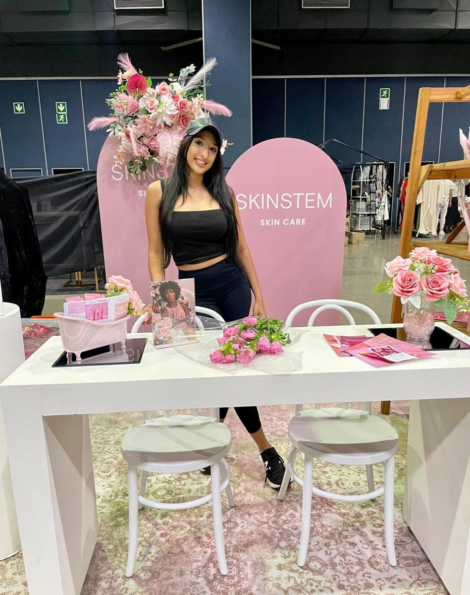 Shaista at a Skinstem stand indoors