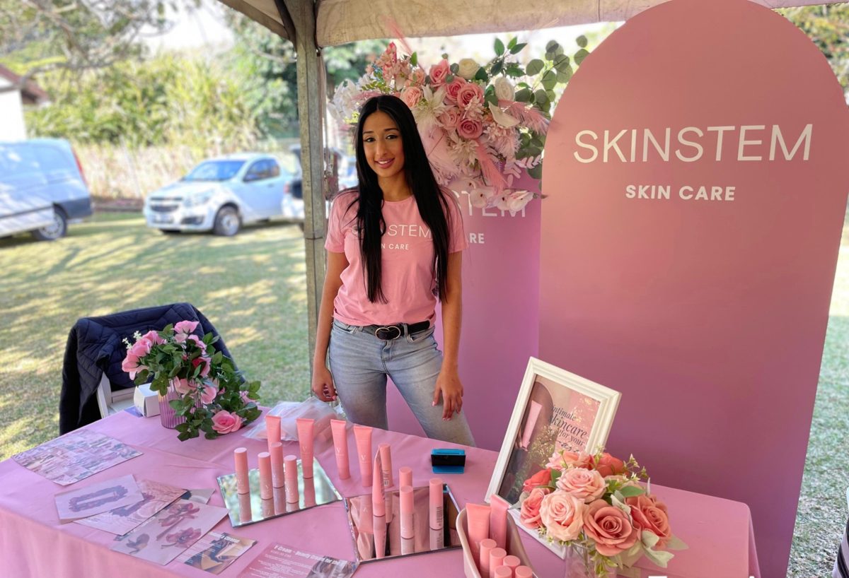 Shaista at a Skinstem stand outdoors