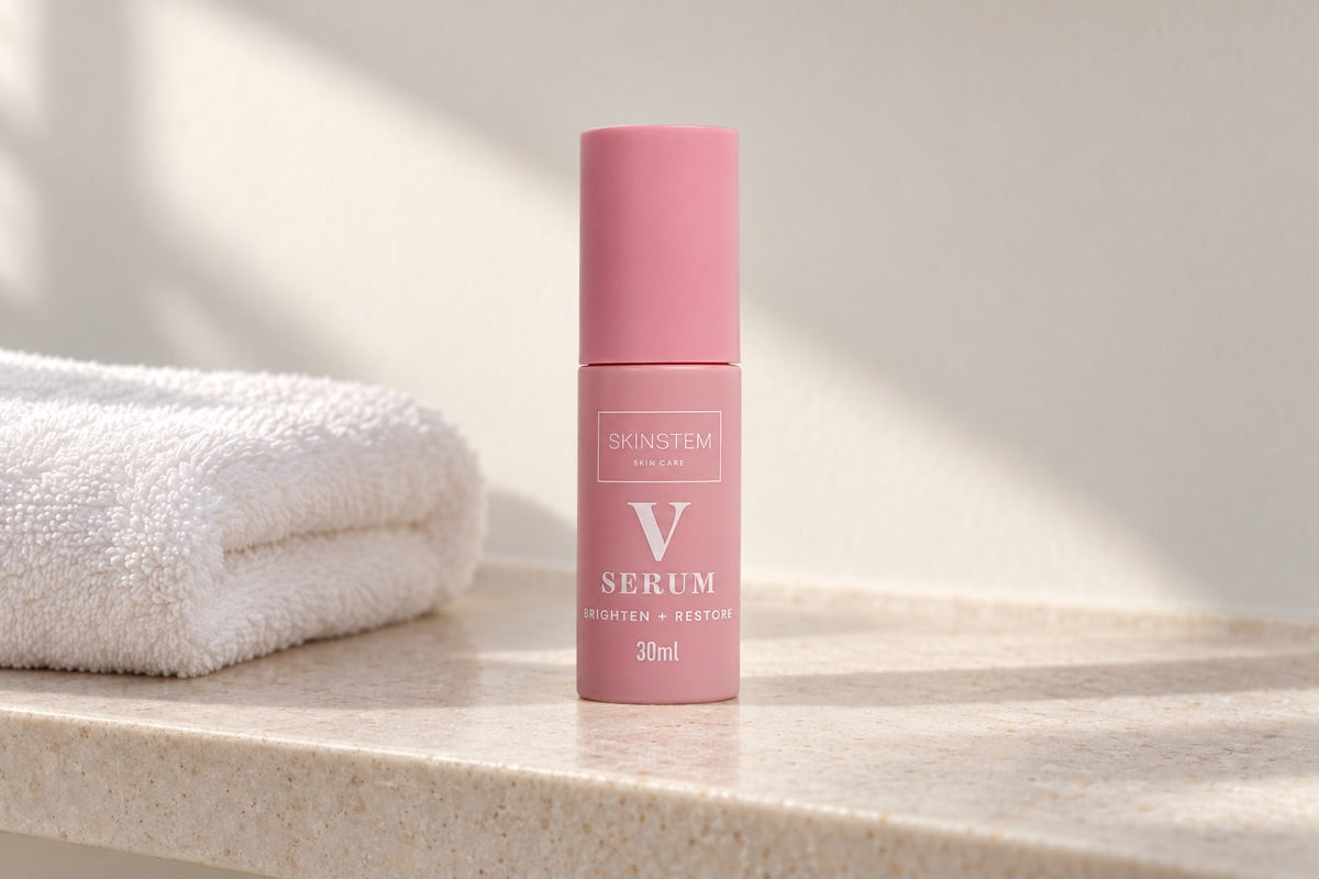 The Skinstem serum on a bathroom shelf next to a folded towel